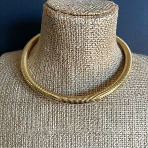 Elegant Gold tone omega choker necklace.